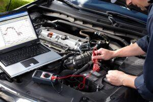 mechanic running car diagnostics test